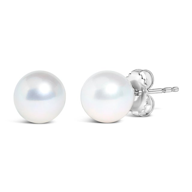 Discover the understated elegance of these exquisite cultured freshwater pearl stud earrings, a testament to classic style...