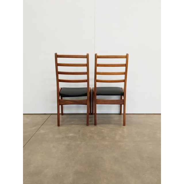 Pair of authentic vintage mid century modern dining chairs. By G Plan. Maker's label on bottoms. This set is in very good...