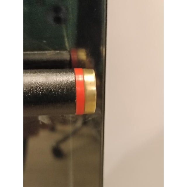 Rare display cabinet designed by Carlo Scarpa for the Italian company Bernini in the 1970s. Black-stained wood and glass...