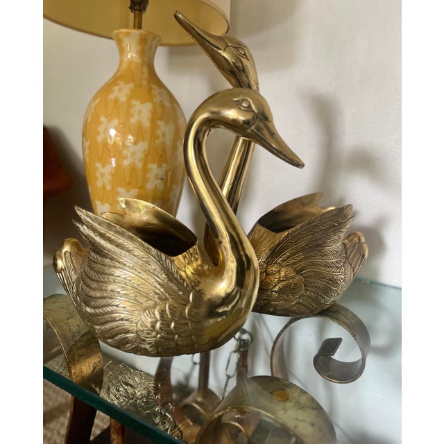 Add some vintage charm to your tabletop with these graceful brass swan planters. These beautiful pieces are in good...