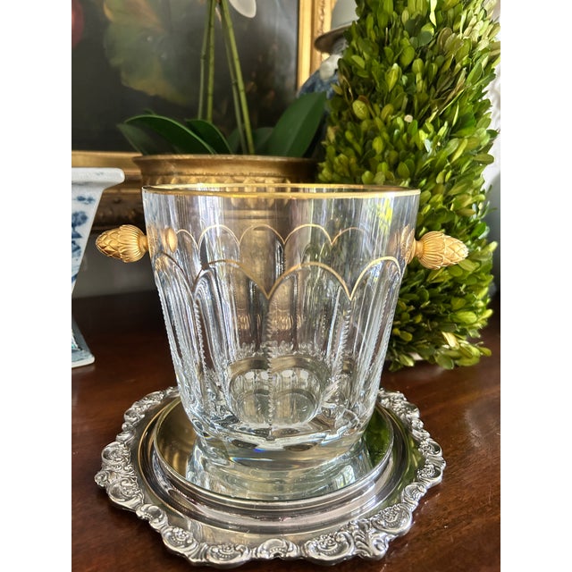Elegant Fabergé crystal champagne or ice bucket featuring a beautifully cut crystal body accented with gilt bronze trim...