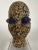 Beaded head from Cameroon on lucite plinth. Having a clay foundation, and meticulously adorned with multi-color beading...