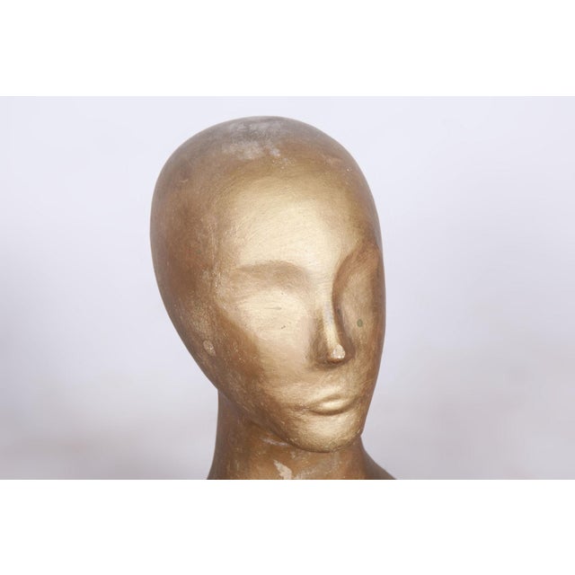 This impressive bust dates back to the 1960s and is made of patinated plaster, which gives it a specific historical...
