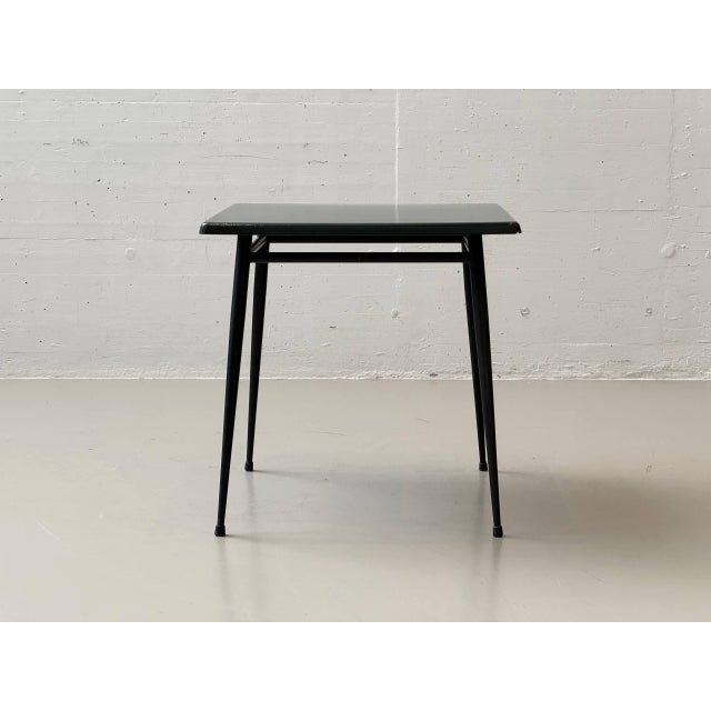 This functional yet distinctive garden table exemplifies the robust outdoor aesthetic of the 1960s and 70s. The square...