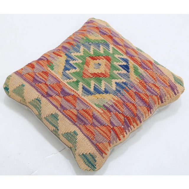 A one-of-a-kind handwoven Afghan wool kilim accent pillow featuring bold diamond medallion. Cut and sewn by hand from a...