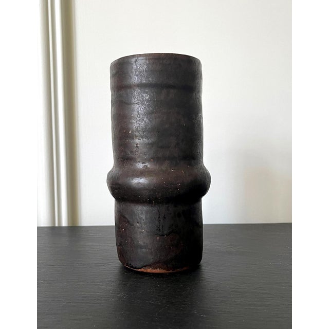 A ceramic vase by American artist and studio potter Beatrice Wood (1893-1998). The piece, circa 1980s, is of a columnar...