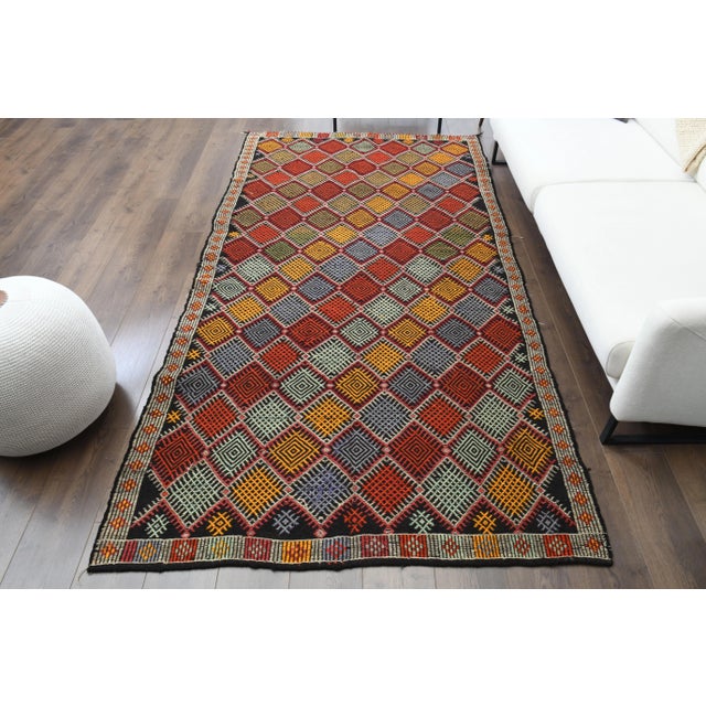 Vintage Turkish Hand-Knotted vintage rug is a semi-antique vintage Area rug.'70s Eastern region of Turkey's unique rug is...