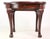 Vintage Queen Anne style mahogany wood side table with cabriole legs. There is a winding key socket on the side of the...