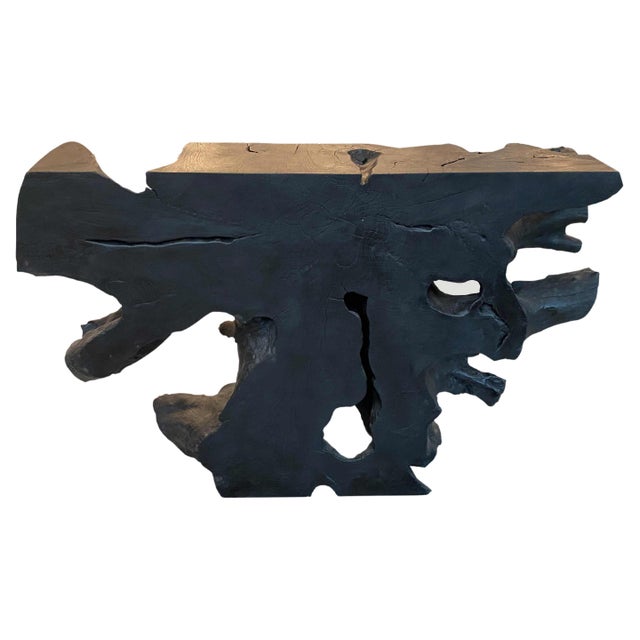 Impressive reclaimed teak wood console table hand carved from a single root and burnt to achieve this stunning finish....