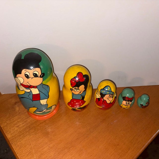 This is a unique find- a hand made set of Matryoshka Russian nesting dolls featuring Disney characters, including Mickey...