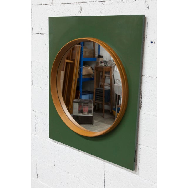 Unique 60cm round wall mirror with a teak frame, mounted on a 90x77cm rectangular green board, dating from the 1960s. New...