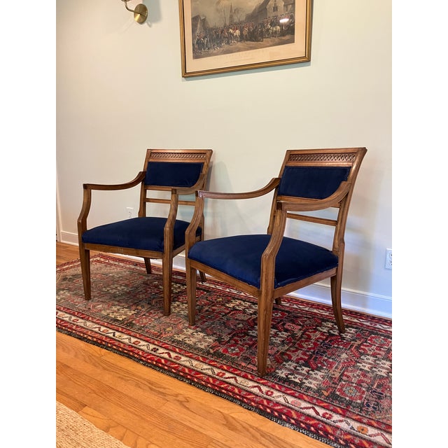 A pair of stylish early 1900's (1905-1920) armchairs in a regency style. Possibly late 19th century. Carved wooden frames...