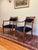 A pair of stylish early 1900's (1905-1920) armchairs in a regency style. Possibly late 19th century. Carved wooden frames...
