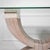A cerused pencil reed and tessellated stone console table in an elegant curule form with ribbon detailing. Attributed to...