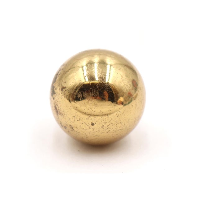 Reclaimed ball shaped cabinet or drawer knob, made of brass with a polished finish. A mounting screw is included. Good...