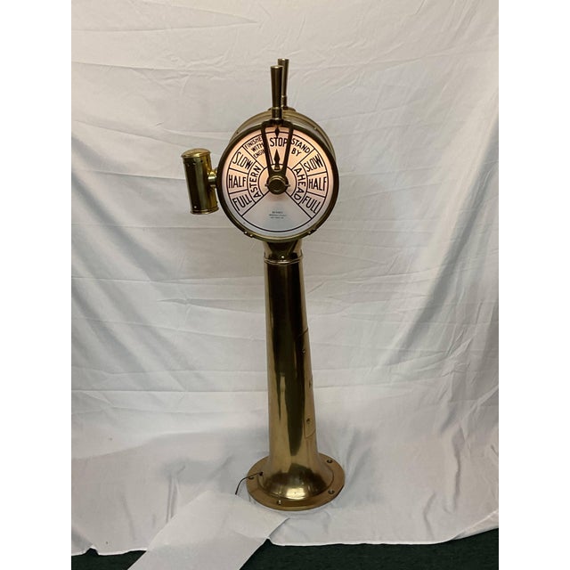 Polished brass ships engine order telegraph by Bendix of Brooklyn N.Y. Serial number CB-13402-5A is also shown. Ships...