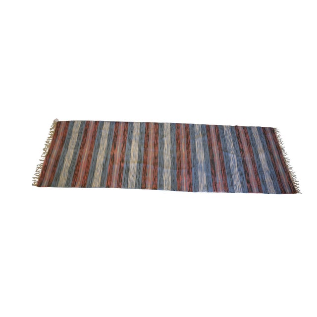 Beautiful Swedish handwoven rag rug in blue and red tones, complemented by touches of beige and black. The classic color...