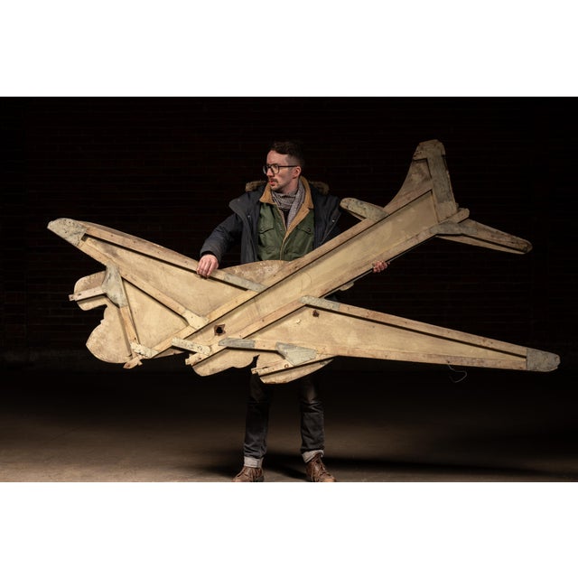 Large-scale painted masonite wall display depicting a four-engine U.S. Army Air Corps bomber, rendered in olive drab with...