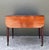 This elegant vintage mahogany drop leaf table is a refined example of mid-20th-century craftsmanship, offering timeless...