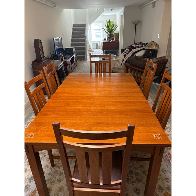 Stickley Harvey Ellis Oak Dining table with inlays, six chairs and two table leaves. The set is in excellent condition....