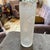 The item is a clear glass cylinder vase, characterized by a heavily textured "brutalist" surface. This textured effect...
