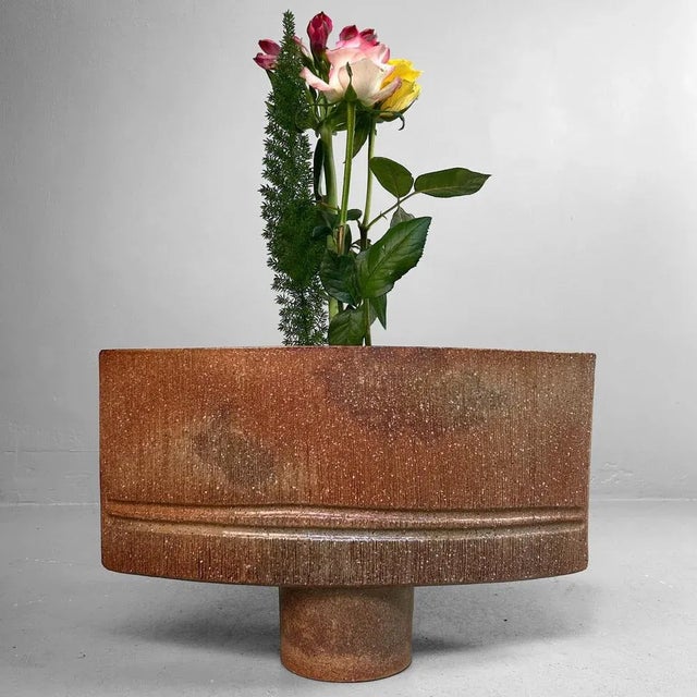 A striking modernist ikebana piece from Japan, crafted in the 1960s. This vase features a clean and sculptural form with a...