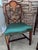 The chairs were originally purchased from Baker Furniture. The chair is a Hepplewhite style mahogany shield-back armchair...