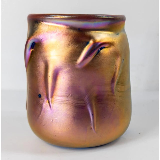 We are selling this pretty Aurene glazed art glass vase. This vase has gold colored exterior on a blue body with...