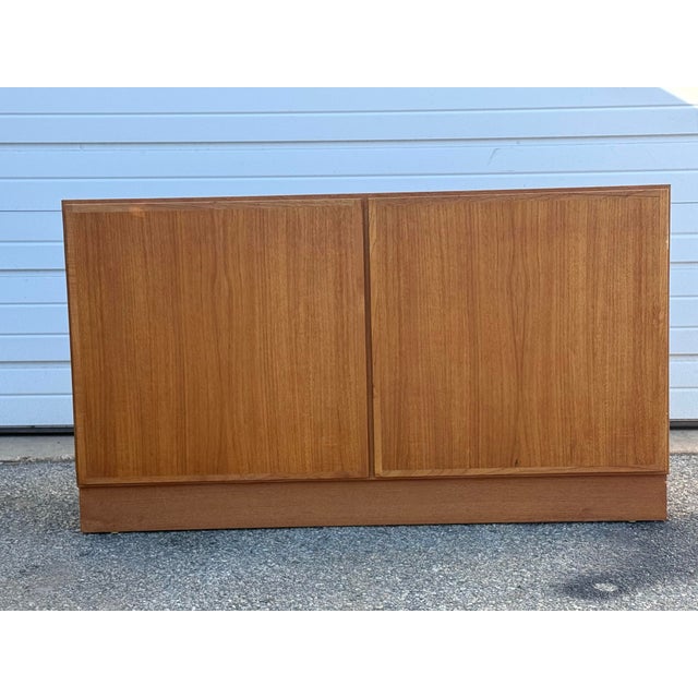 Mid-Century Danish Modern Teak Mini Sideboard/Credenza Offered is a Mid-Century Danish Modern Teak Credenza. This piece...