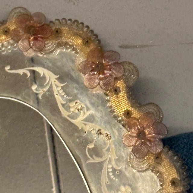 Mid-century modern Murano glass mirror from Venice, oval shape, from the 1950s. with pink flowers and satin designs. Size...