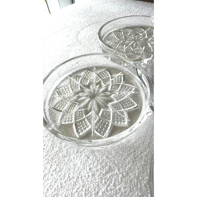 VTG MCM molded glass coaster-ashtray combo brings a touch of Atomic Age elegance to any tabletop. This set features a...