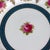A distinguished set of twelve antique English porcelain luncheon plates, crafted by Cauldon and retailed by the esteemed...