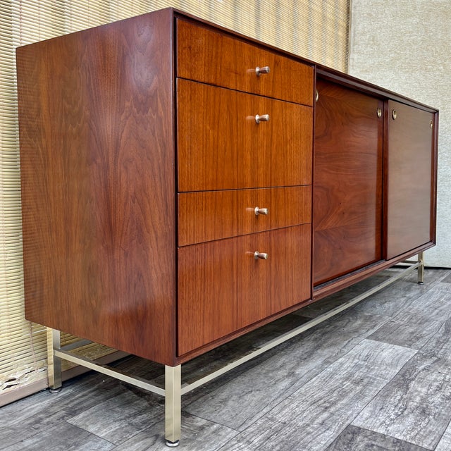 Vintage Refinished Mid Century Modern Twelf Drawer Dresser By John Stuart. Circa 1960s. Features a quintessential Sleek...