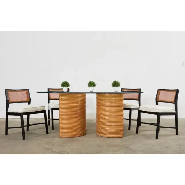Fantastic Mid-Century Modern Italian double pedestal dining table crafted from split reed rattan. The organic modern...