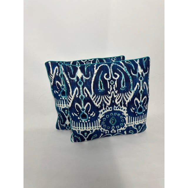 Striking tribal print pillows in a deep blue with white and electric blue details. Complete with plain white backs, tiny...