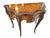 Elegant Louis XV-style console with a serpentine floral-marquetry top, an inlaid apron, cabriole legs and abundant gilt...