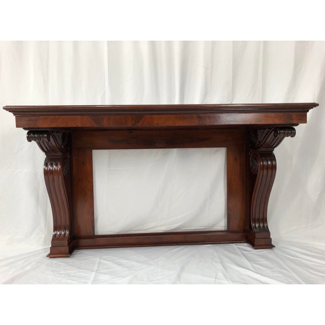 Beautiful English Regency mahogany console table of rectangular form with two Acanthus scroll supports.The quality of...