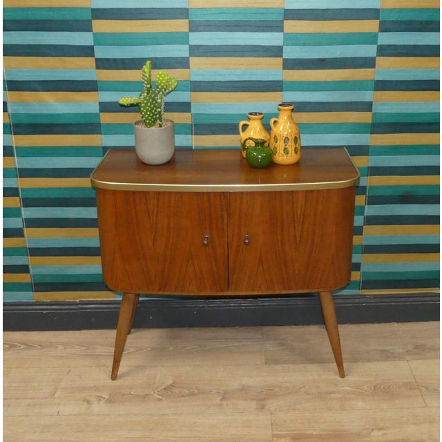 Stylish piece of furniture In a simple, timeless design Small cabinet with two doors and a single compartment Semi-rounded...
