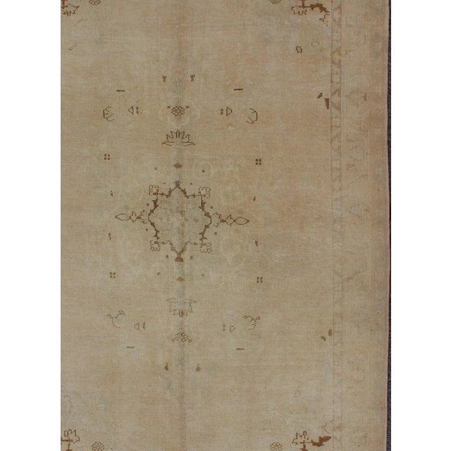 Measures: 5'1 x 7'9. Vintage Turkish Oushak Rug in Faded Taupe and Ivory with Subtle Medallion. Keivan Woven Arts / rug...