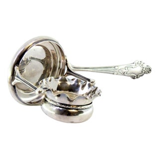 Silver Tea Strainer with Wavy Cup-Shaped Reservoir and Shell-Shaped Reliefs Handle For Sale