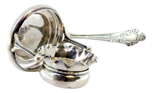 Silver Tea Strainer with Wavy Cup-Shaped Reservoir and Shell-Shaped Reliefs Handle