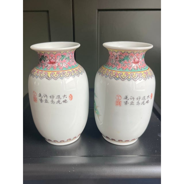 Gorgeous condition. This matched petite pair of Chinese Jingdezhen famille rose vases will make the perfect set for your...