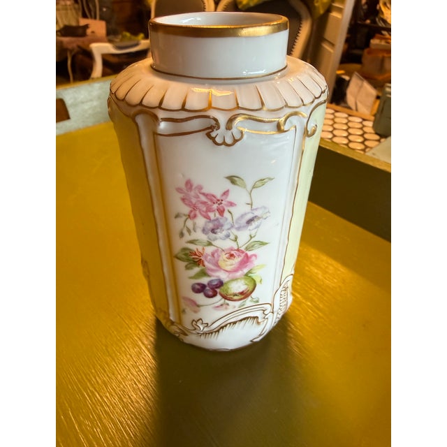 : A tea caddy (originally featuring a matching porcelain lid) designed in the Rococo Revival style, characterized by...