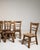 A distinguished set of six French oak dining chairs from circa 1970, rendered in the clean, purposeful spirit of Mid-...