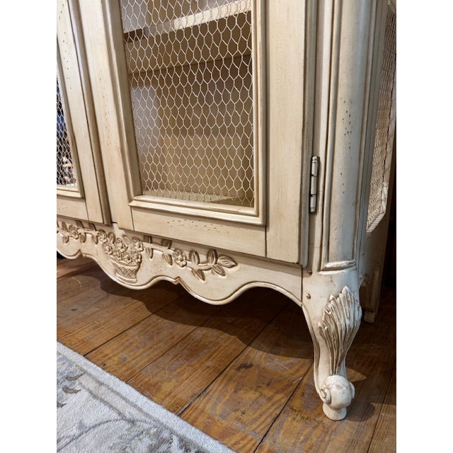 Vintage Country French Display Cabinet w/chicken wire. Cabinet has a lot of great features, including 2 glass shelves and...