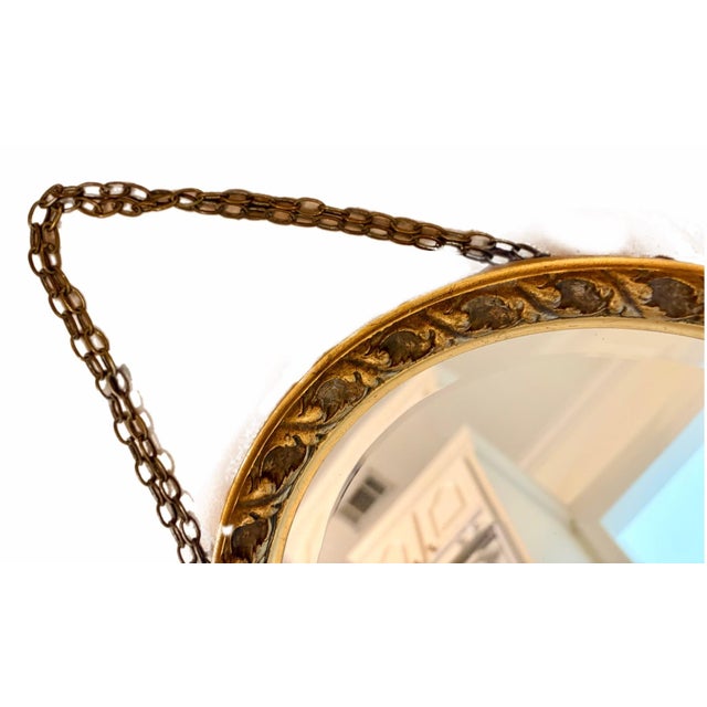 Elegant vintage oval mirror crafted from wood and finished in beautifully aged gold leaf. The softly distressed finish and...