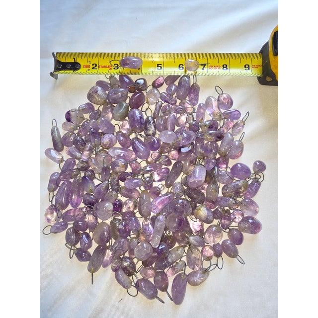 175 little quartz pebbles with wires attached to each one. These would be great added to a chandelier or pair of sconces...