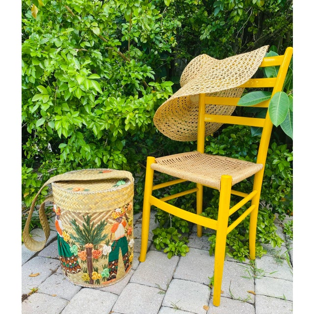 Mid Century Yellow Italian chair. Ladder back with long legs. The seat is made with cord roping. The chair retains its...