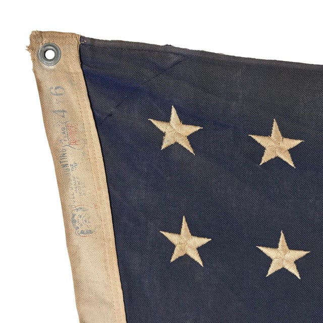 This large vintage American flag is made from a cotton cloth, with fully sewn stripes and 48 embroidered stars. Please...