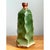 This sculptural vase presents an angular, faceted silhouette that reads as distinctly modernist, its tall, bottle-like...